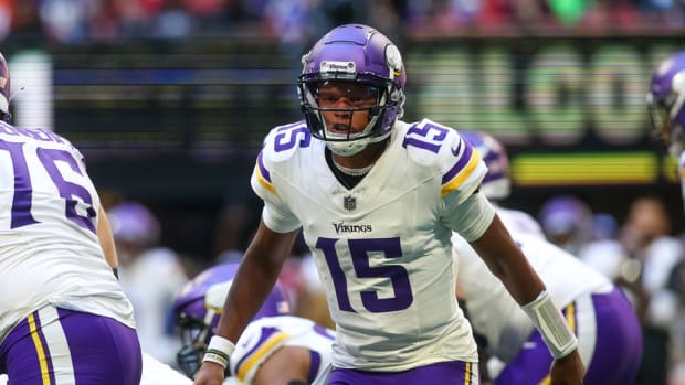 Minnesota Vikings quarterback Joshua Dobbs (15) calls a play against the Atlanta Falcons in the first half at Mercedes-Benz Stadium.